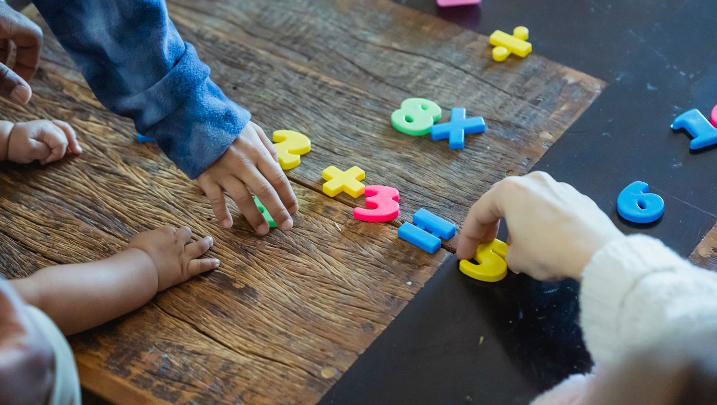 Young children playing a number-matching game